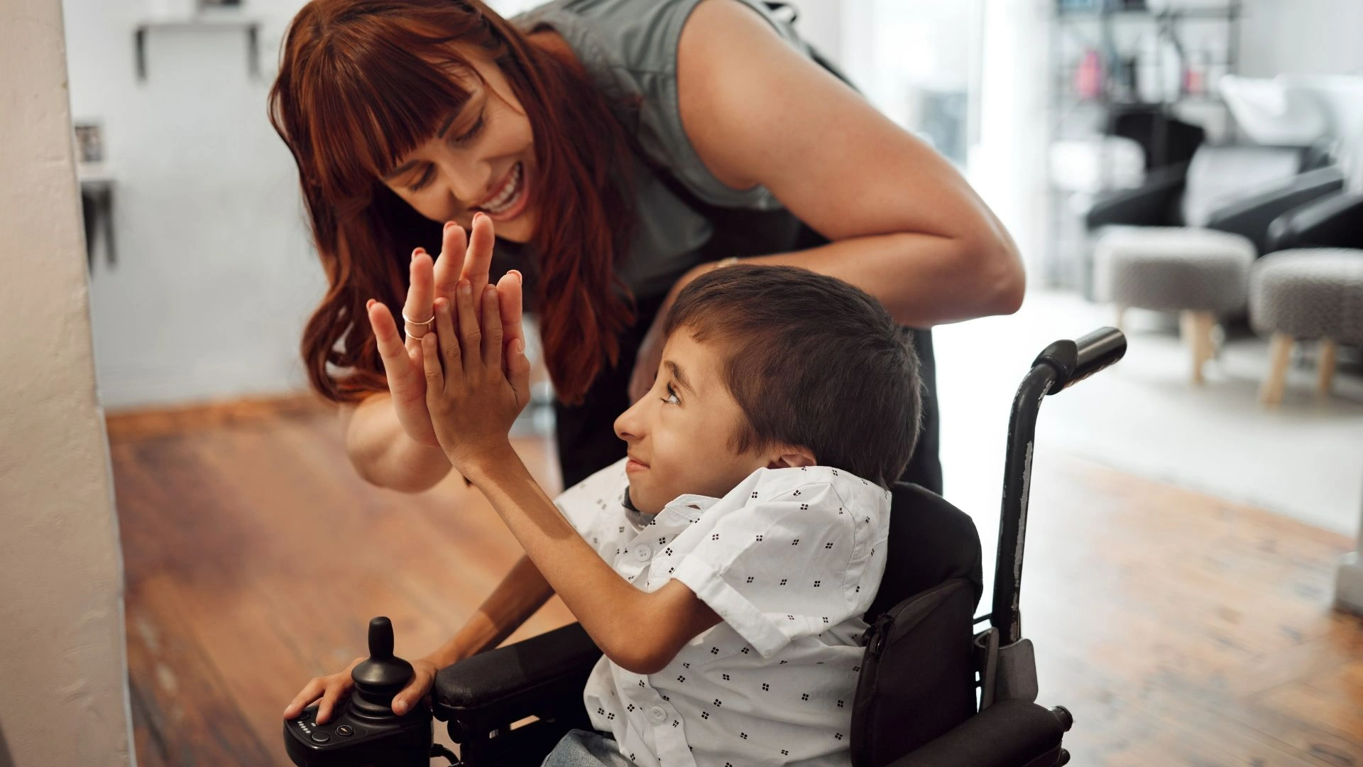 Special Needs Trusts Online - special needs trust organization - Parent hugging a child with Down syndrome, highlighting a special needs trust for child and long-term care planning