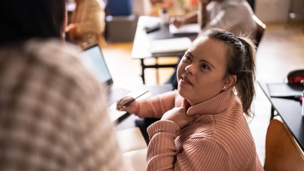 Special Needs Trusts Online - special disability trust - Mother embracing her daughter with Down syndrome while learning how a special needs trust protects her future financial security